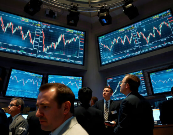 Traders watching volatile market charts on screens at a stock exchange