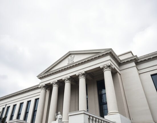 Federal Reserve building in Washington DC with cloudy sky, representing Morgan Stanley forecast of Fed rate hold through 2026