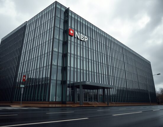 Narodowy Bank Polski headquarters in Warsaw on a cloudy day, representing monetary policy stance.