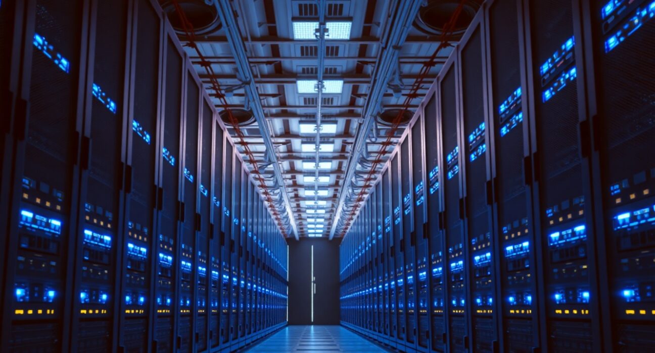 Interior of a modern data center with illuminated server racks and networking equipment