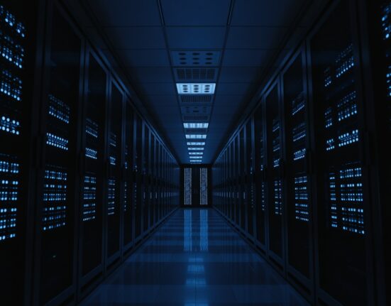 Modern server room with blue-lit servers representing cryptocurrency data processing
