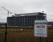 Construction of a large data center halted under New York state moratorium with official signage