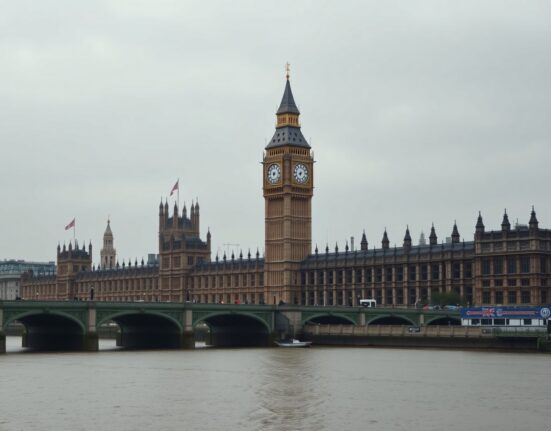 Palace of Westminster and Big Ben in London on a cloudy day, representing UK Parliament and political news.