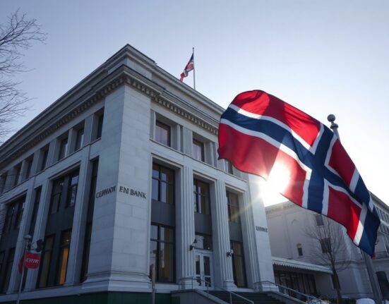 Norges Bank building in Oslo on a clear winter day, with Norwegian flag in foreground.
