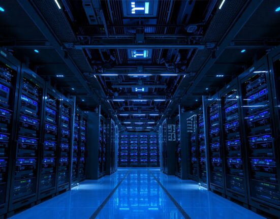 Interior of a modern AI data center with Nvidia GPU server racks illuminated by blue lights