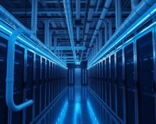 Interior of a modern data center with liquid cooling pipes and server racks illuminated by blue light