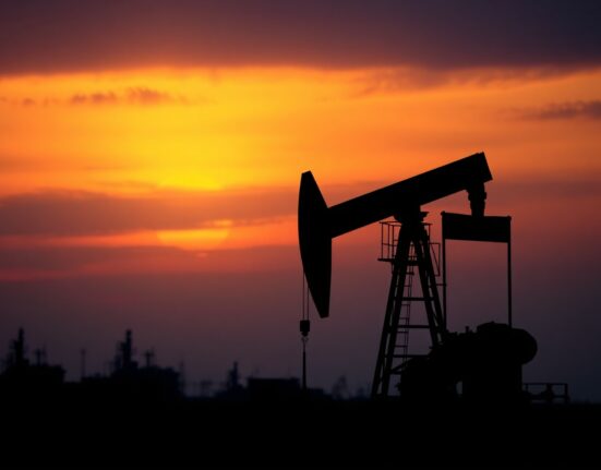 Oil pumpjack at dusk, symbolizing market uncertainty