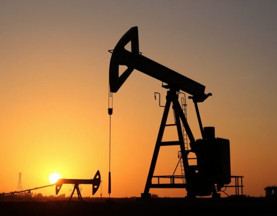 Oil pumpjack silhouetted at sunset, representing global oil markets and geopolitical tensions.