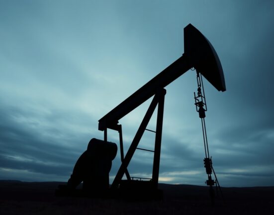 Oil pumpjack against overcast UK sky, representing energy costs and inflation