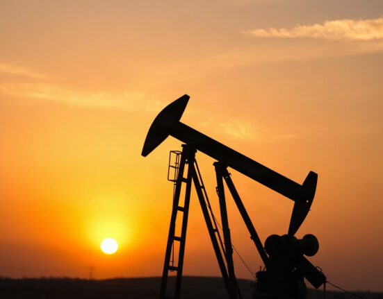 Oil pumpjack silhouette at sunset, symbolizing energy markets amid geopolitical tension.