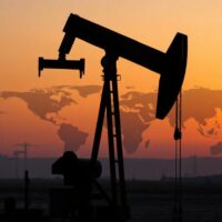 Oil pumpjack silhouette at dusk representing oil supply and geopolitical risks