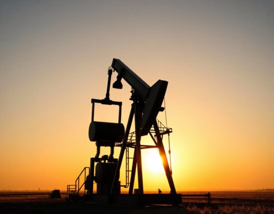 Oil pumpjack silhouetted at sunset, symbolizing energy market uncertainty