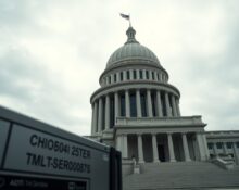 Government building with AI server hardware in foreground symbolizing AI regulation
