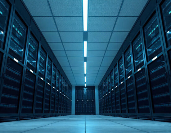 Interior of a modern data center with rows of servers, symbolizing OpenAI's infrastructure challenges.