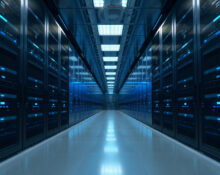 Data center corridor with server racks symbolizing enterprise AI privacy and security.
