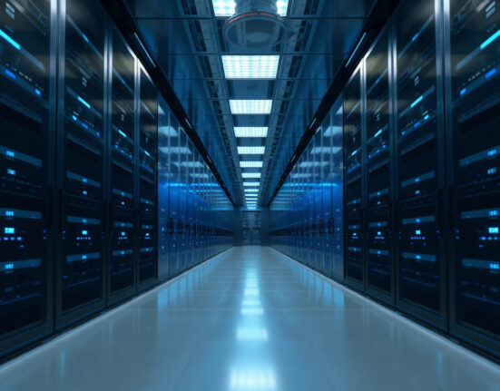 Data center corridor with server racks symbolizing enterprise AI privacy and security.
