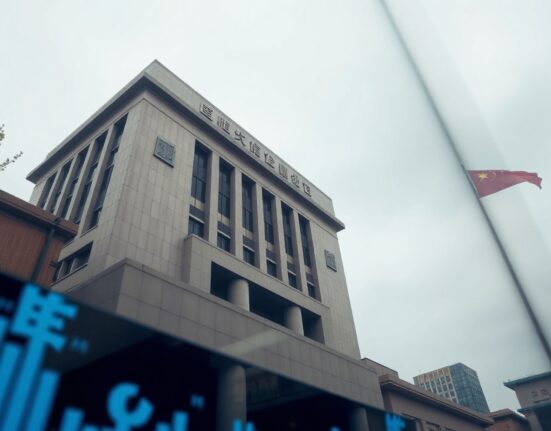 Exterior of the People's Bank of China headquarters in Beijing on an overcast day.