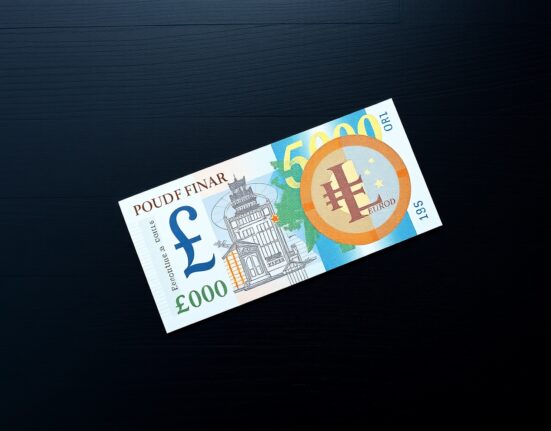 British Pound and Euro banknotes on a dark surface representing forex market analysis.