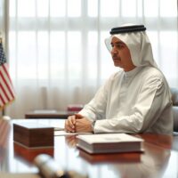 Qatari diplomat at a meeting table, representing mediation efforts between the US and Iran