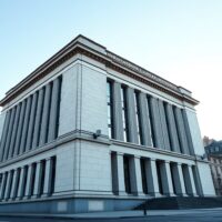 Riksbank headquarters in Stockholm representing Swedish monetary policy decisions affecting the SEK.