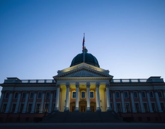 Exterior view of the Russian State Duma building in Moscow at dusk