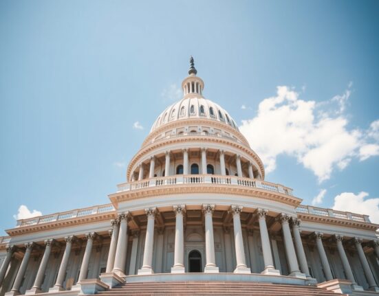 U.S. Capitol Building under a clear blue sky, representing legislative action on the CLARITY bill.