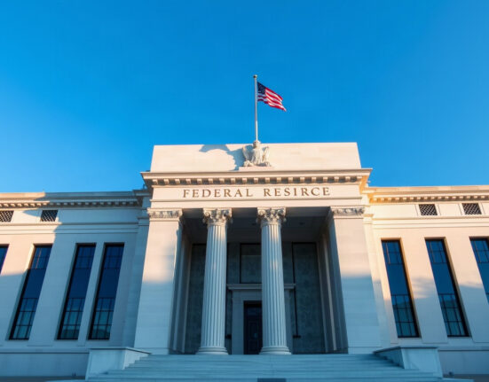 Federal Reserve building in Washington, D.C. under a clear sky, symbolizing monetary policy decisions.