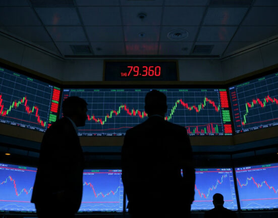 Trading floor with screens showing bond yields and market charts at the start of September