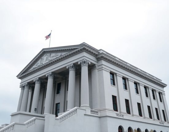 U.S. Treasury building in Washington, D.C., on a cloudy day, representing bond market uncertainty and Fed policy fears.