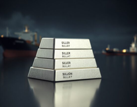 Silver bullion bars stacked on a reflective surface with a blurred shipping lane background