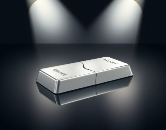 Silver bullion bar with crack symbolizing downside risks in precious metals market, OCBC analysis