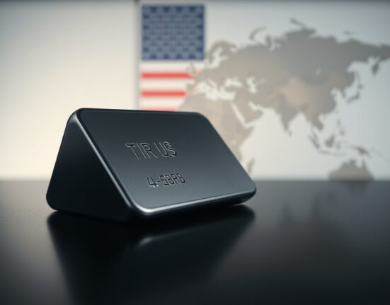Silver bar on reflective surface with American flag and Middle East map in background