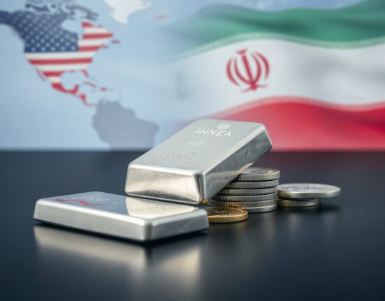 Silver bars and coins with a subtle global backdrop representing geopolitical market influences