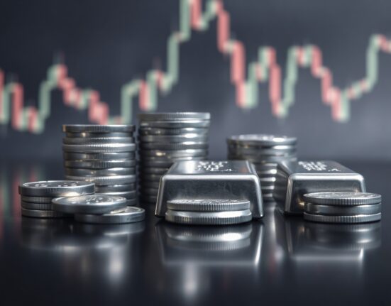 Silver bullion coins and bars reflecting market uncertainty amid hawkish Fed sentiment