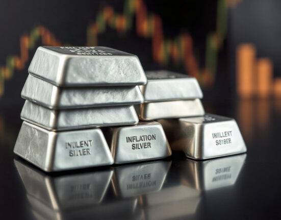 Silver bullion bars stacked, representing the metal's price rebound and market uncertainty.
