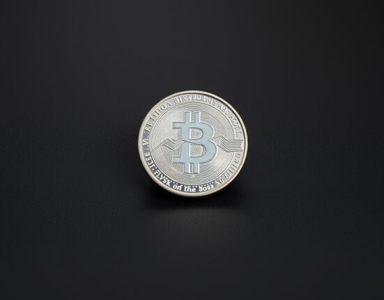 Silver bullion coin on dark surface representing a breakout above resistance levels