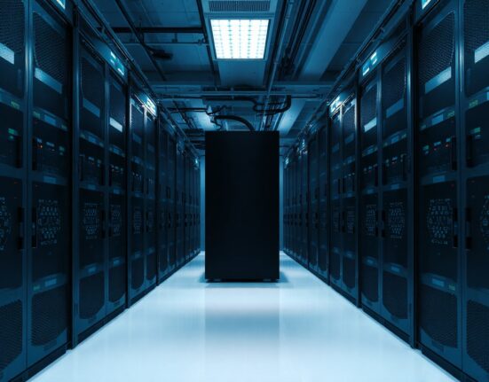 Partially darkened server racks in a data center representing a Solana validator outage