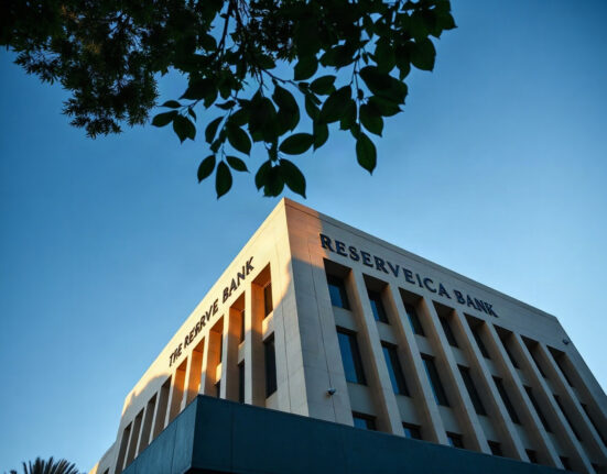 South African Reserve Bank building in Pretoria on a clear day, representing economic policy and inflation.