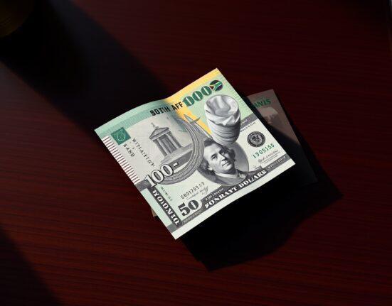 South African rand currency declining against the strong US dollar in forex markets.