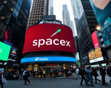 Nasdaq display showing SpaceX stock price surge on IPO day in Times Square
