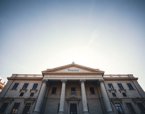 Spanish Treasury building in Madrid on a sunny morning, representing government debt auctions.