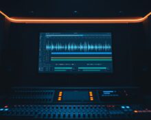 A recording studio monitor displaying an AI-generated audio waveform on a digital audio workstation screen.