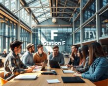 Interior of Station F startup hub in Paris with entrepreneurs working on AI projects
