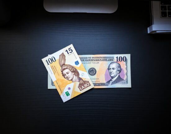 British Pound and US Dollar banknotes on a desk representing currency market stability