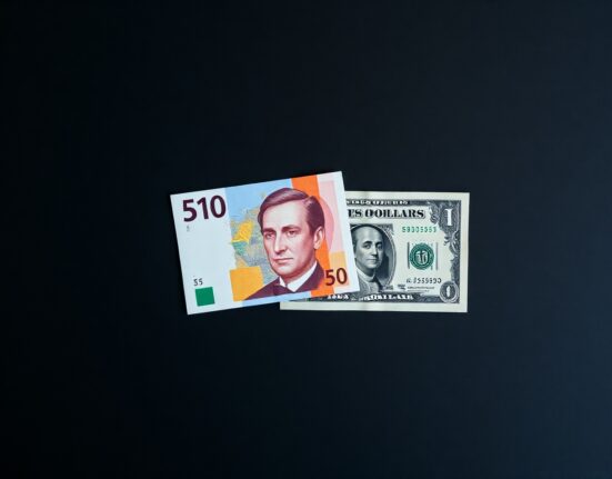 Swiss Franc and US Dollar banknotes representing currency market movement