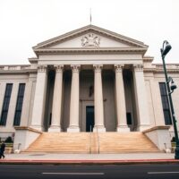 Exterior of the Federal Reserve Building in Washington D.C. under overcast sky.