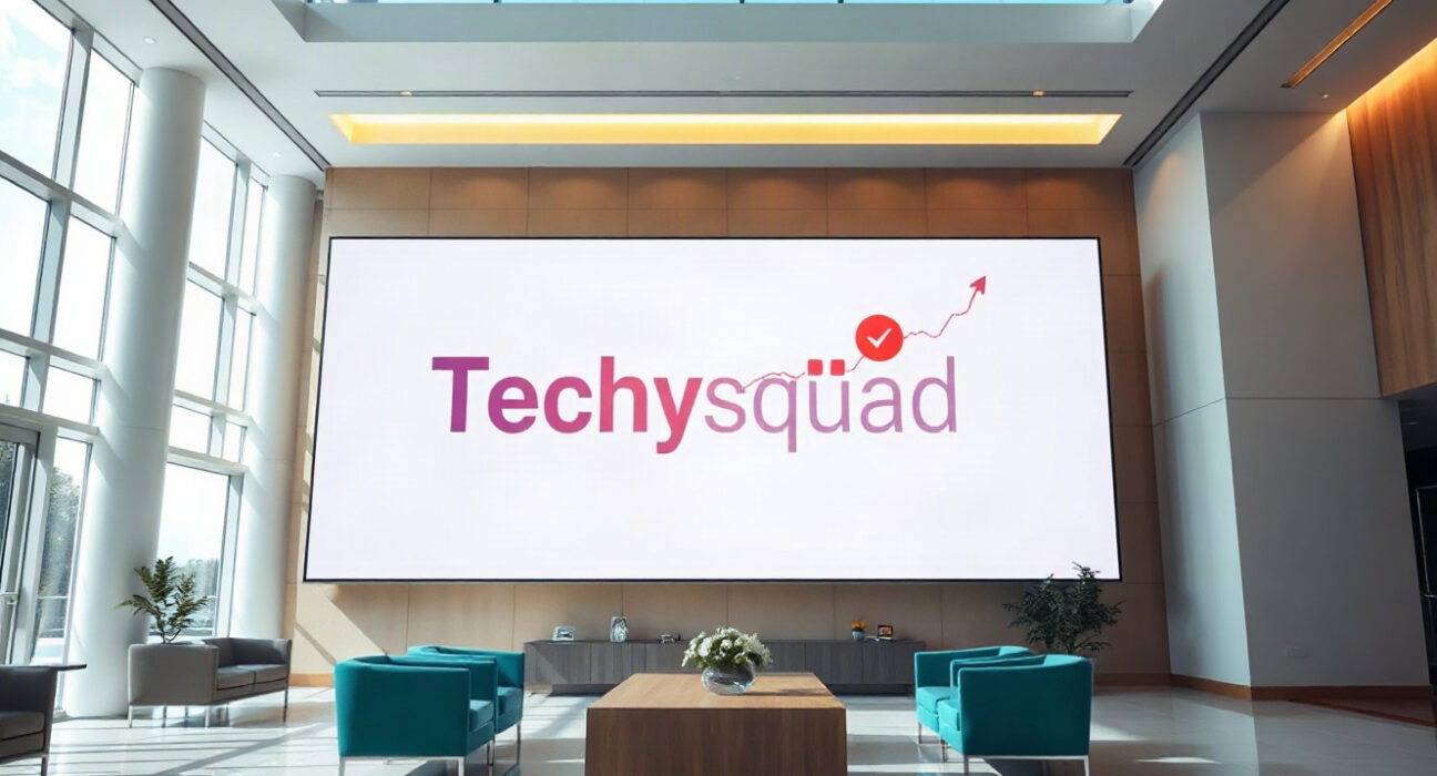 Techysquad's new brand identity displayed on a digital screen in a modern office lobby, symbolizing its focus on the global forex technology ecosystem.