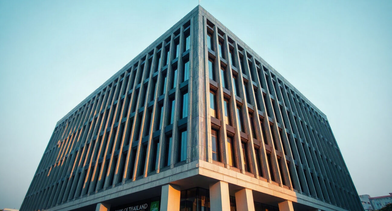 Bank of Thailand headquarters in Bangkok on a clear day, representing stable monetary policy.