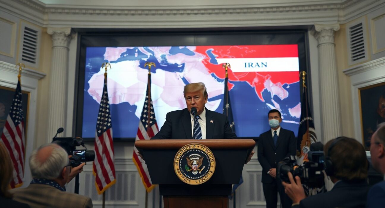 President Trump at White House podium warning of strikes on Iran