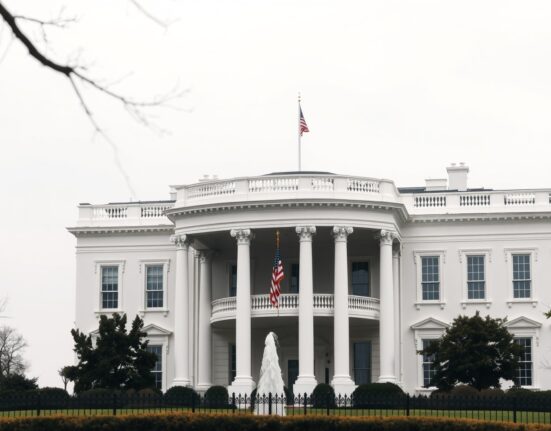 White House exterior under overcast sky, symbolizing US-Iran diplomacy